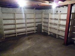 This storage room in the northwest corner of the basement was originally accessible only through a trap door in the ceiling (near the red post). - , Utah